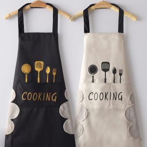 Two High-Quality Waterproof & Oil-Proof Adult Cooking Aprons are displayed in black and beige, featuring printed kitchen utensil graphics, a front pocket with "COOKING" text, and soft side hand-drying towels.